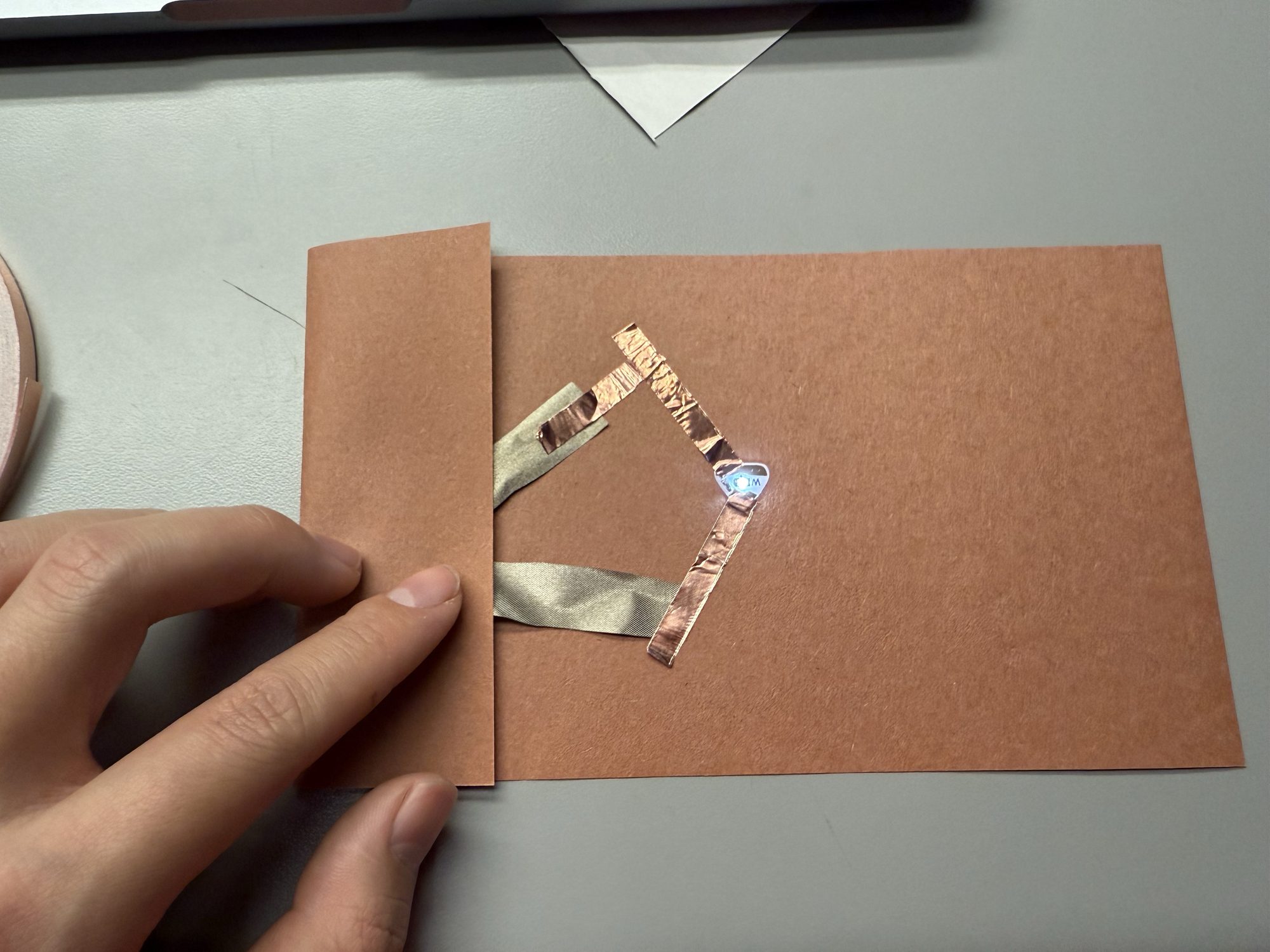 Illustration of a simple electronic circuit made with coin batteries.