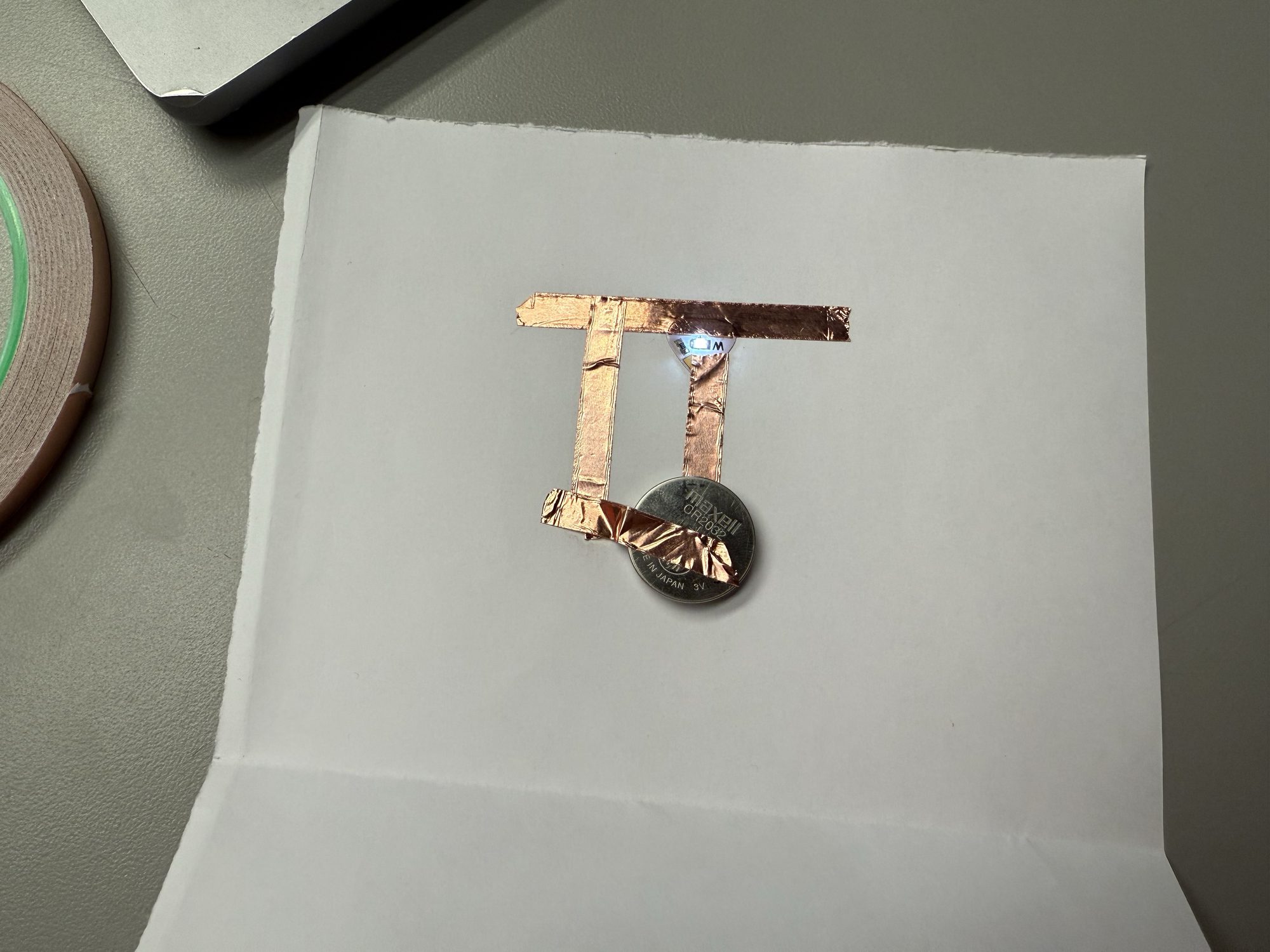 Finalized DIY circuit project with glowing LED stickers.