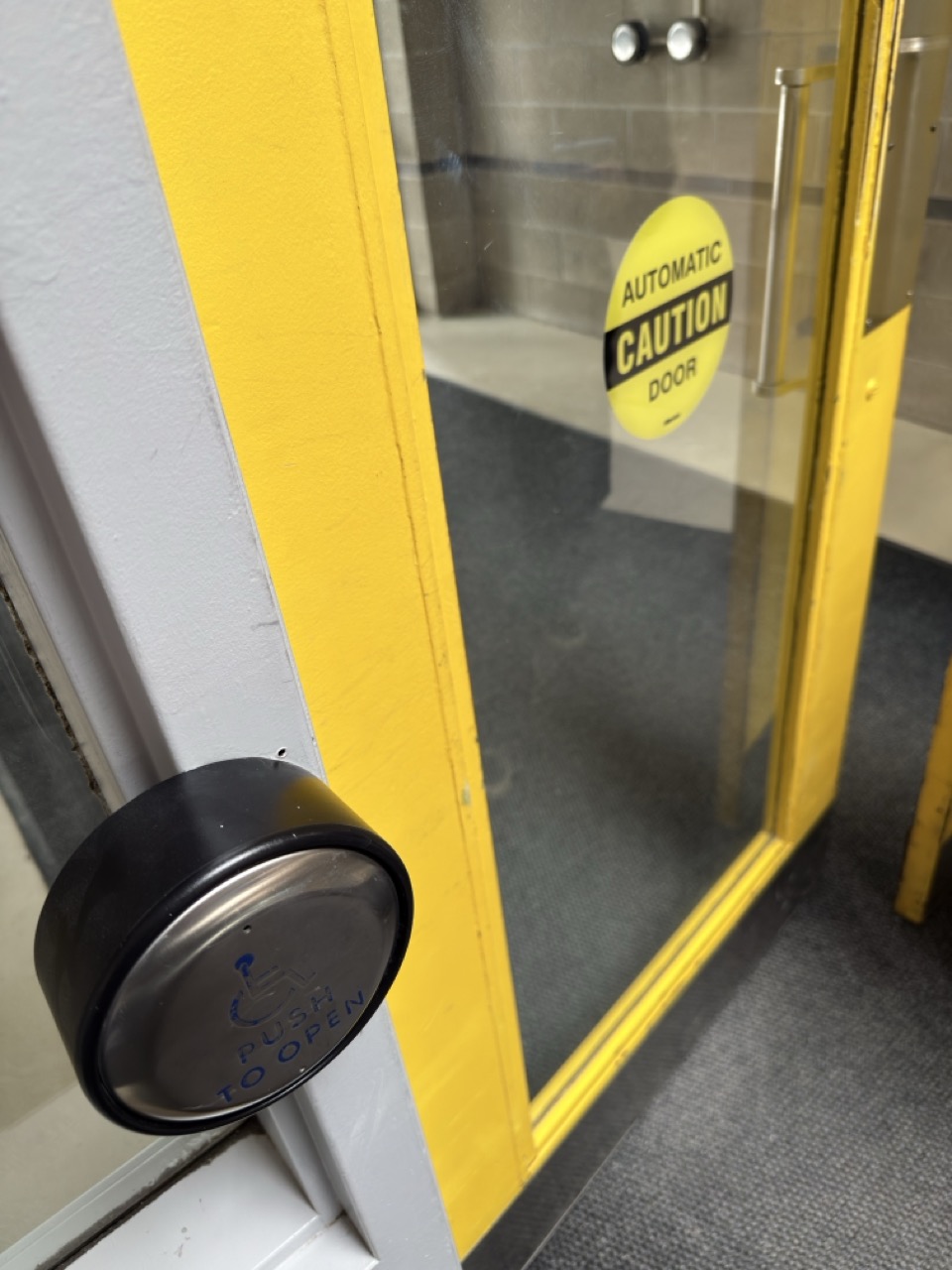 Using button to open a door.