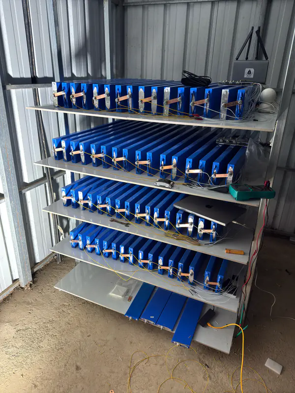 First battery rack with blue cells on four shelves