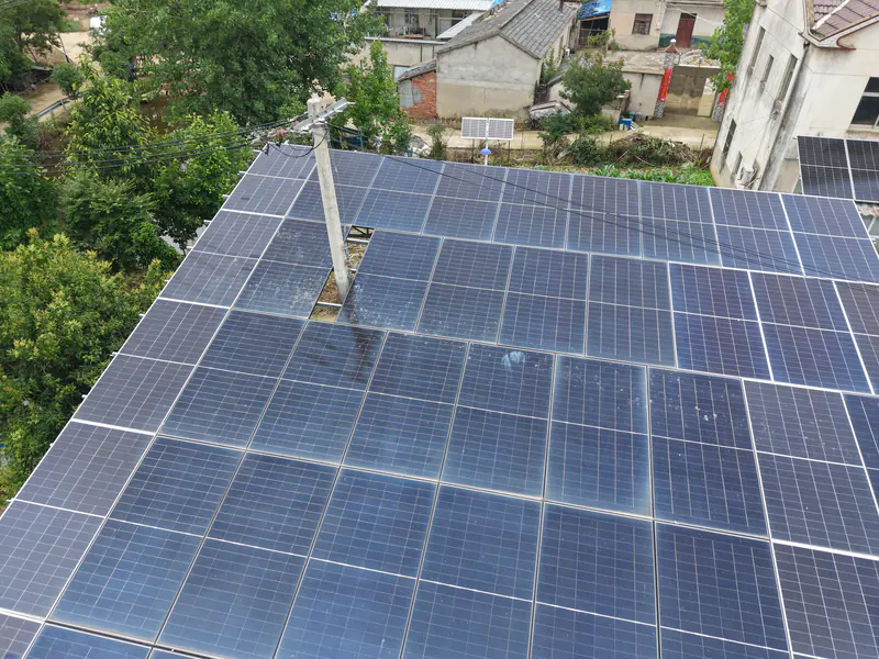 Aerial view of the solar arrays on a farmhouse roof